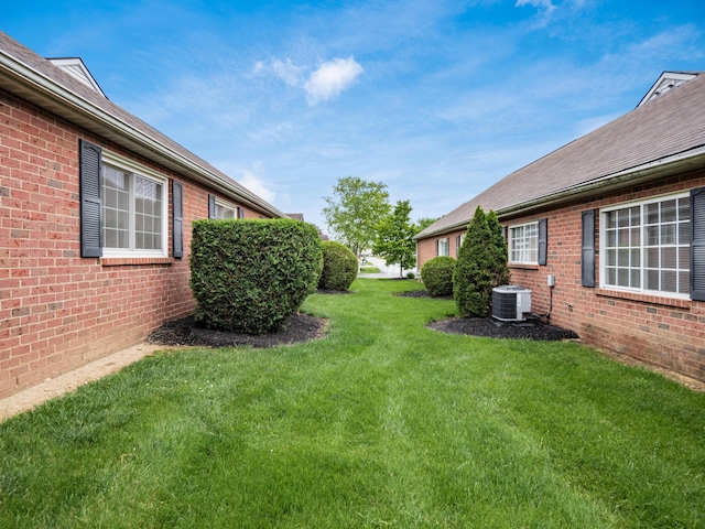 2594 Roberts Ct, Hilliard, OH 43026 - view of grassy yard featuring central air condition unit