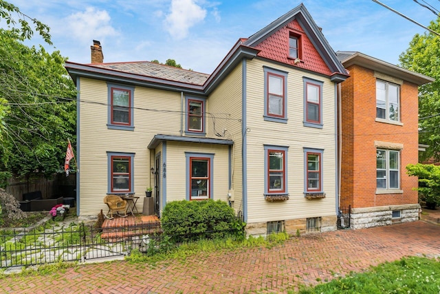 688 S 5th St, Columbus, OH 43206 - victorian house with a chimney and a patio