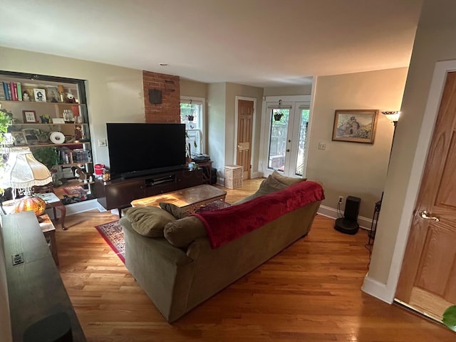 688 S 5th St, Columbus, OH 43206 - living room featuring wood finished floors and baseboards