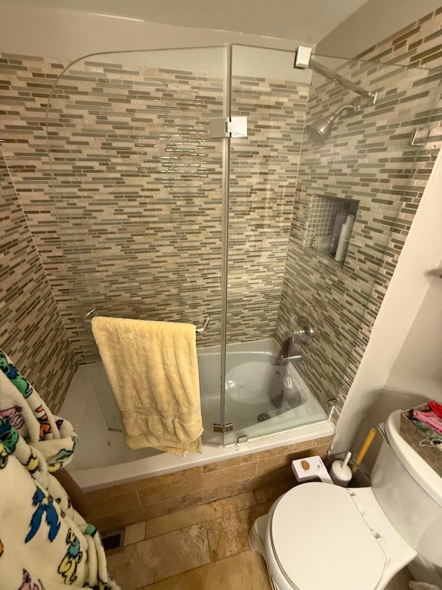 688 S 5th St, Columbus, OH 43206 - full bathroom featuring tiled shower / bath combo and toilet