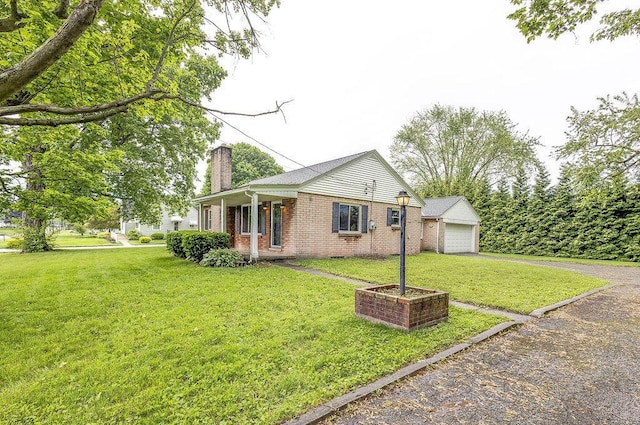 11 Mermary Dr, Fredericktown, OH 43019 - single story home with a chimney, brick siding, a front lawn, and a garage