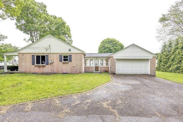 11 Mermary Dr, Fredericktown, OH 43019 - single story home featuring driveway, a garage, brick siding, and a front lawn