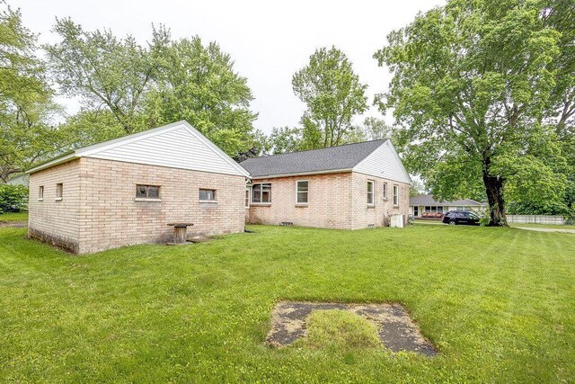 11 Mermary Dr, Fredericktown, OH 43019 - view of side of home featuring a yard, brick siding, and roof with shingles