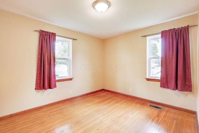 11 Mermary Dr, Fredericktown, OH 43019 - unfurnished room featuring healthy amount of natural light, hardwood / wood-style floors, and baseboards