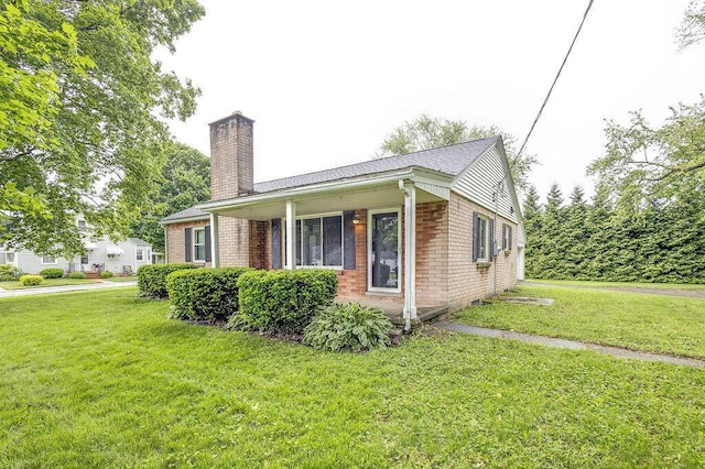 11 Mermary Dr, Fredericktown, OH 43019 - view of property exterior with a chimney, a yard, and brick siding