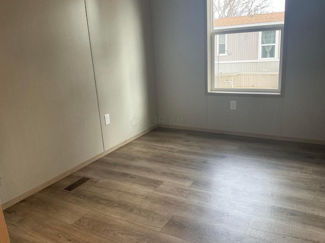 8565 Smith Calhoun Rd Unit 48, Plain City, OH 43064 - unfurnished room with wood finished floors and baseboards