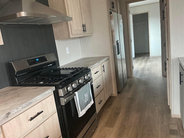 8565 Smith Calhoun Rd Unit 48, Plain City, OH 43064 - kitchen featuring appliances with stainless steel finishes, exhaust hood, dark wood-style flooring, light brown cabinetry, and light countertops