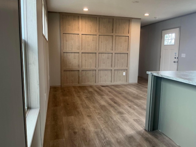 8565 Smith Calhoun Rd Unit 48, Plain City, OH 43064 - unfurnished living room with light wood-style flooring, recessed lighting, and baseboards