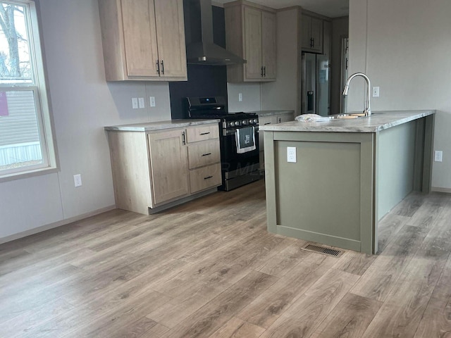 8565 Smith Calhoun Rd Unit 48, Plain City, OH 43064 - kitchen featuring appliances with stainless steel finishes, wall chimney exhaust hood, a sink, light wood finished floors, and baseboards