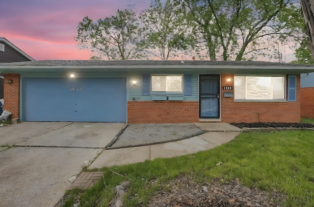 4980 Comstock Dr, Columbus, OH 43232 - ranch-style house with an attached garage, brick siding, and driveway