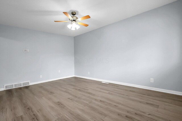 4980 Comstock Dr, Columbus, OH 43232 - empty room featuring wood finished floors, ceiling fan, and baseboards