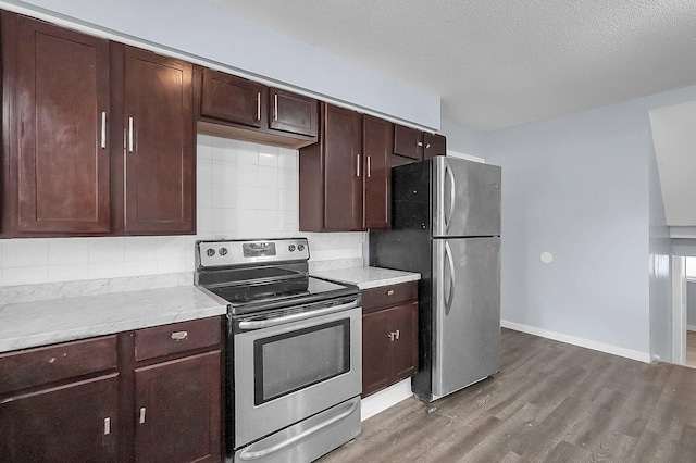 4980 Comstock Dr, Columbus, OH 43232 - kitchen with stainless steel appliances, light wood finished floors, decorative backsplash, light countertops, and dark brown cabinets