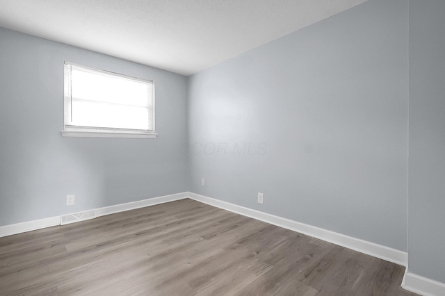 4980 Comstock Dr, Columbus, OH 43232 - unfurnished room with wood finished floors and baseboards