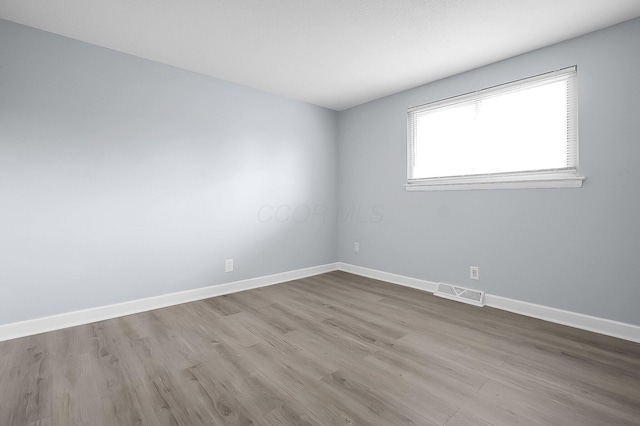 4980 Comstock Dr, Columbus, OH 43232 - spare room featuring wood finished floors and baseboards