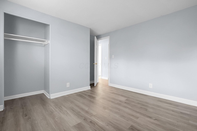 4980 Comstock Dr, Columbus, OH 43232 - unfurnished bedroom featuring wood finished floors, baseboards, and a closet