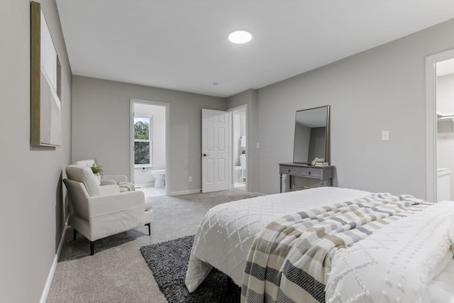 338 Gentlewind Dr, Westerville, OH 43081 - bedroom with carpet floors, baseboards, and connected bathroom