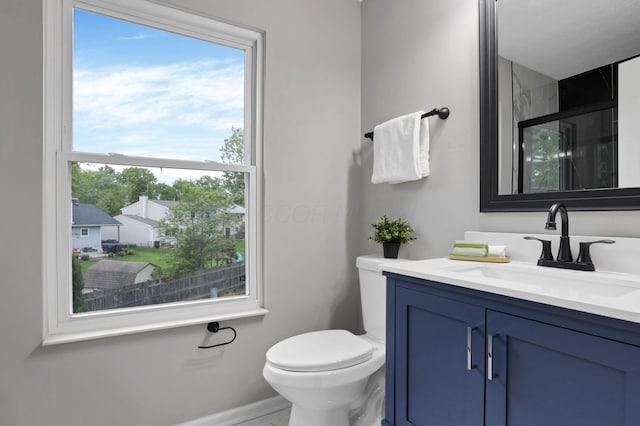338 Gentlewind Dr, Westerville, OH 43081 - full bathroom with toilet, vanity, a shower with shower door, and baseboards