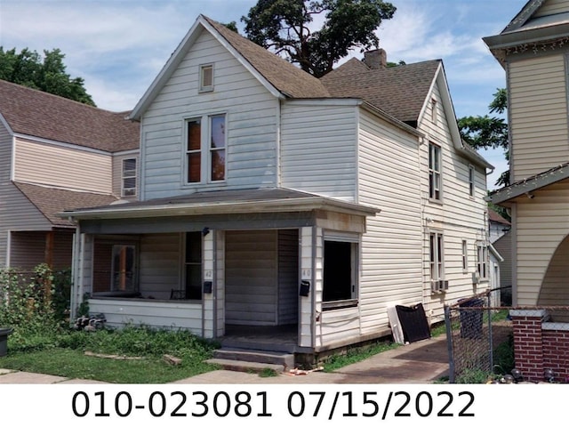 40 Wisconsin Ave, Columbus, OH 43222 - view of front of house with a porch, a shingled roof, and a chimney