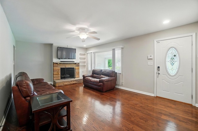 1096 Lancaster Ave, Reynoldsburg, OH 43068 - living area with a stone fireplace, ceiling fan, wood-type flooring, baseboards, and recessed lighting