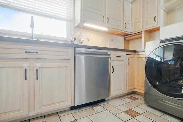 1096 Lancaster Ave, Reynoldsburg, OH 43068 - kitchen featuring stainless steel dishwasher, washer / dryer, tasteful backsplash, and light tile patterned floors