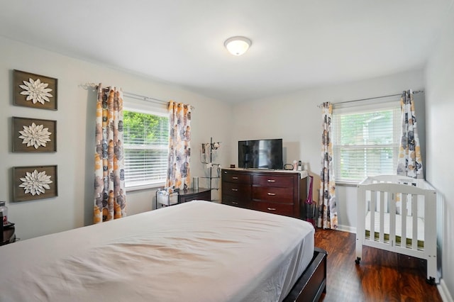 1096 Lancaster Ave, Reynoldsburg, OH 43068 - bedroom with dark wood-style flooring and baseboards