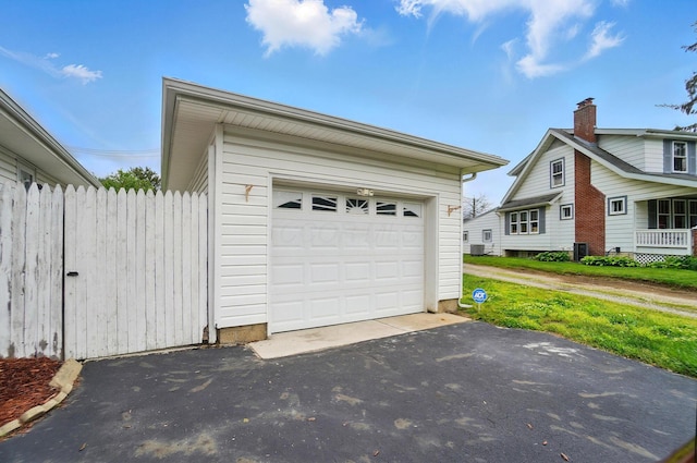 1096 Lancaster Ave, Reynoldsburg, OH 43068 - garage featuring driveway and central AC unit