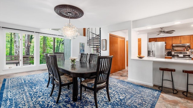 4171 Clotts Rd, Columbus, OH 43230 - dining room featuring stairs, a chandelier, recessed lighting, a ceiling fan, and baseboards