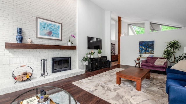 4171 Clotts Rd, Columbus, OH 43230 - living area featuring high vaulted ceiling, wood finished floors, and a brick fireplace