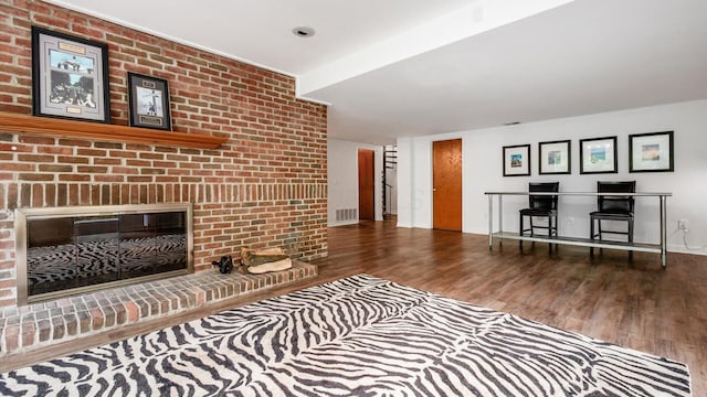 4171 Clotts Rd, Columbus, OH 43230 - living room featuring wood finished floors, a fireplace, and baseboards