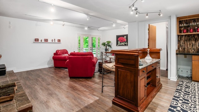 4171 Clotts Rd, Columbus, OH 43230 - living area featuring light wood-style floors, rail lighting, french doors, and baseboards