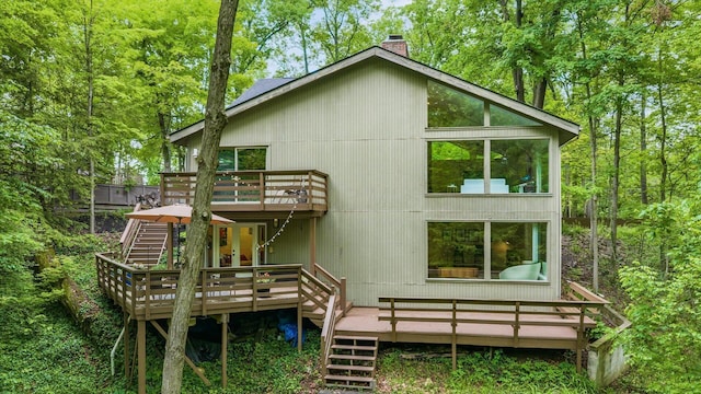 4171 Clotts Rd, Columbus, OH 43230 - rear view of property with stairs, a deck, and a chimney