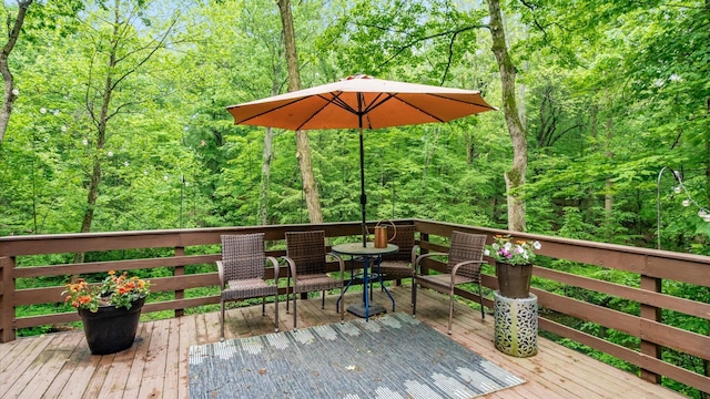 4171 Clotts Rd, Columbus, OH 43230 - wooden terrace with outdoor dining area and a forest view