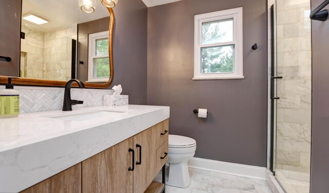 114 Highland Ave, Worthington, OH 43085 - full bathroom with vanity, toilet, baseboards, a stall shower, and marble finish flooring