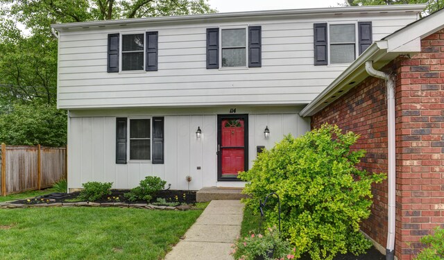 114 Highland Ave, Worthington, OH 43085 - colonial-style house featuring brick siding and board and batten siding