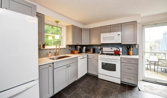 114 Highland Ave, Worthington, OH 43085 - kitchen with white appliances, a sink, gray cabinetry, and dark tile patterned floors
