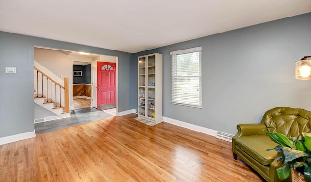 114 Highland Ave, Worthington, OH 43085 - living area with baseboards, stairway, and wood finished floors