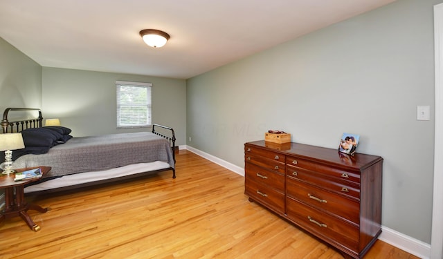 114 Highland Ave, Worthington, OH 43085 - bedroom with light wood-style flooring and baseboards