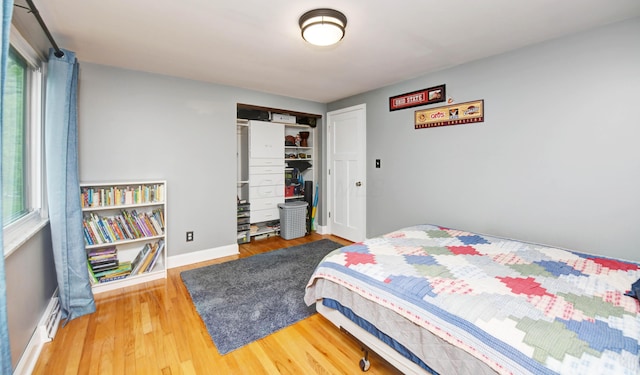 114 Highland Ave, Worthington, OH 43085 - bedroom featuring wood finished floors, a closet, and baseboards