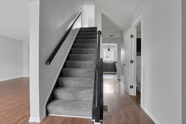 6446 Berry Pond Way, Canal Winchester, OH 43110 - stairway featuring wood finished floors and baseboards