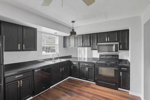 6446 Berry Pond Way, Canal Winchester, OH 43110 - kitchen featuring black appliances, a ceiling fan, dark countertops, a sink, and a textured ceiling