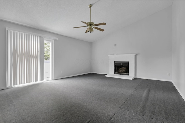 6446 Berry Pond Way, Canal Winchester, OH 43110 - unfurnished living room with lofted ceiling, ceiling fan, a brick fireplace, dark carpet, and baseboards