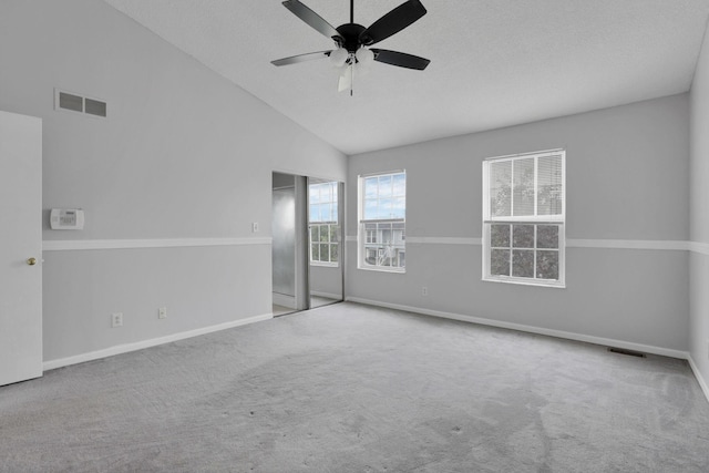 6446 Berry Pond Way, Canal Winchester, OH 43110 - carpeted spare room with a ceiling fan, baseboards, high vaulted ceiling, and a textured ceiling