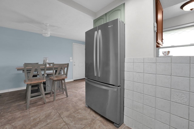 1508 Ives Ave, Reynoldsburg, OH 43068 - kitchen featuring freestanding refrigerator, green cabinets, tile walls, tile patterned flooring, and a ceiling fan