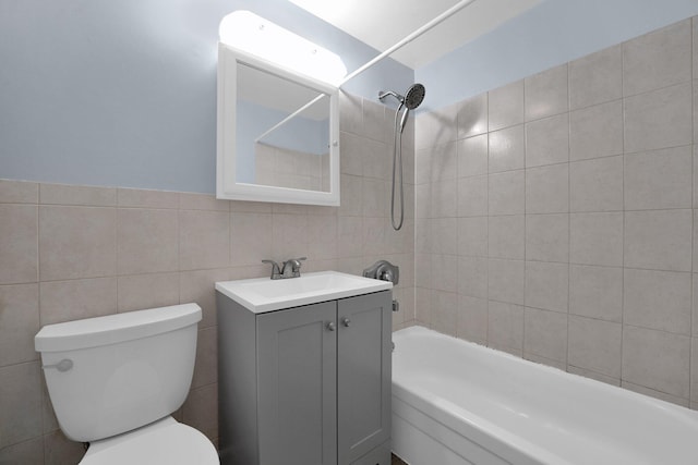 1508 Ives Ave, Reynoldsburg, OH 43068 - bathroom featuring bathing tub / shower combination, toilet, tile walls, and vanity