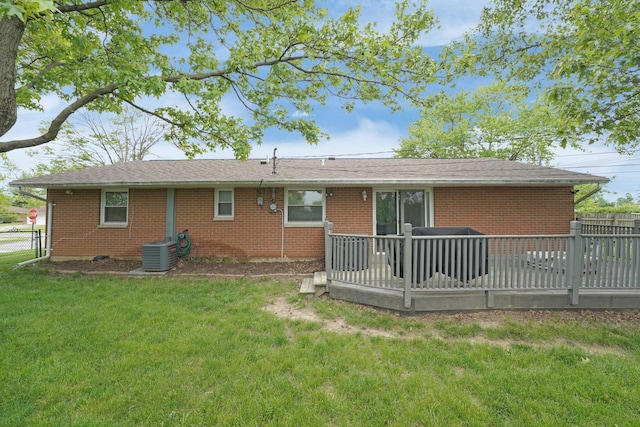1508 Ives Ave, Reynoldsburg, OH 43068 - back of property featuring central air condition unit, brick siding, and a wooden deck