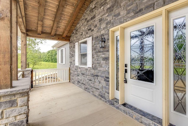 228 E Walnut St, Danville, OH 43014 - view of exterior entry with covered porch and stone siding