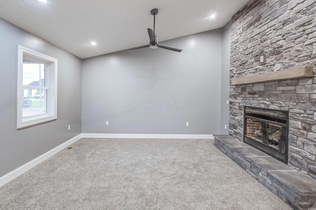 228 E Walnut St, Danville, OH 43014 - unfurnished living room with ceiling fan, carpet flooring, a fireplace, baseboards, and recessed lighting