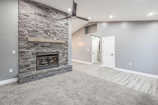 228 E Walnut St, Danville, OH 43014 - unfurnished living room with baseboards, a fireplace, ceiling fan, carpet, and lofted ceiling
