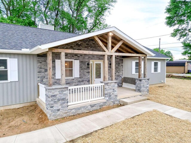 228 E Walnut St, Danville, OH 43014 - craftsman inspired home featuring covered porch, board and batten siding, stone siding, and roof with shingles