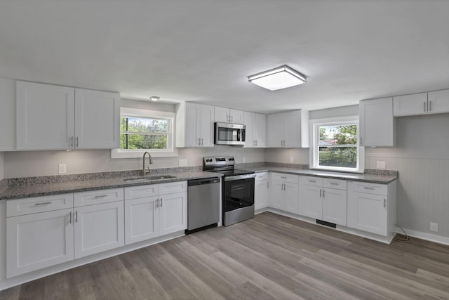 901 E Vine St, Mount Vernon, OH 43050 - kitchen featuring stainless steel appliances, a sink, plenty of natural light, and white cabinets